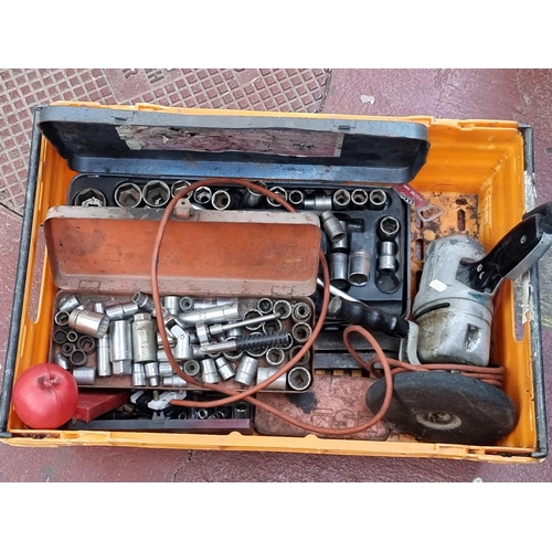 348 - A box of tools including a heavy duty car buffer, two socket sets and others.