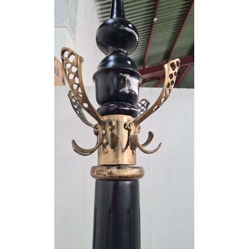 877 - Star lot : A fabulous large coat stand, featuring a black lacquered wooden column with brass hooks a... 