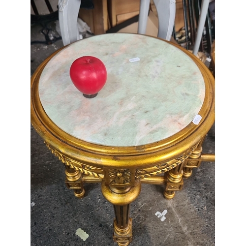 884 - Star lot : A lovely Pair of gilt wood side tables with round cold Italian  marble tops, featuring or... 