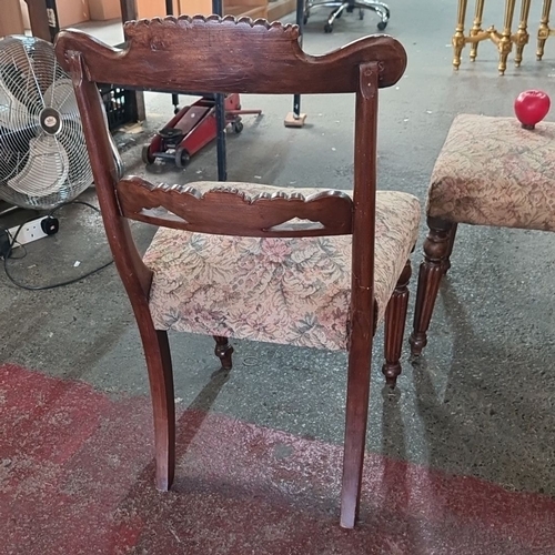 886 - Four Victorian dining chairs with carved mahogany frames and floral upholstered seats.