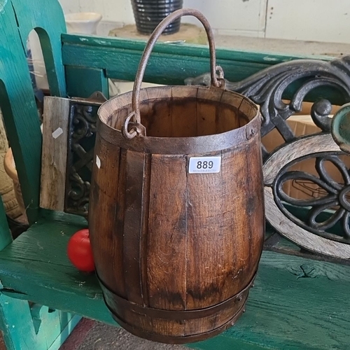 889 - A Wooden bucket with iron handle and bands, featuring a dark patina, from the 19th century.