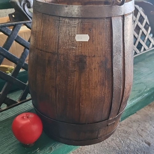 889 - A Wooden bucket with iron handle and bands, featuring a dark patina, from the 19th century.