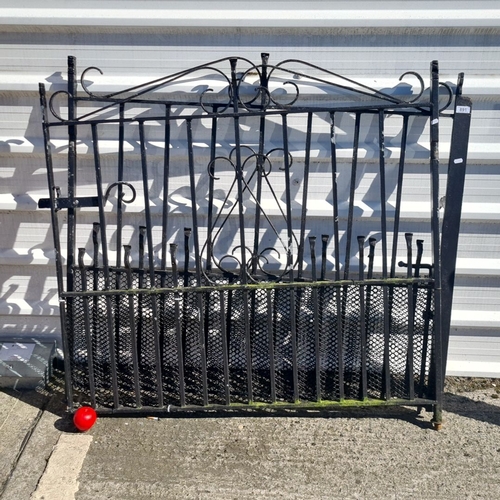 891 - Star Lot : Decorative wrought iron garden gate features ornate scrollwork and mesh panel detailing. ... 