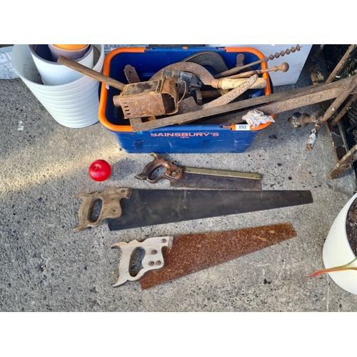 892 - Mixed lot of vintage hand tools, including three saws with wooden handles and various metal tools wi... 