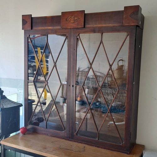 893 - Antique Georgian mahogany display cabinet with glass-paneled doors and carved seashell motif. It was... 