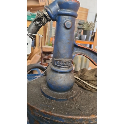 898 - Vintage blue hand-operated oil pump with hose, marked 