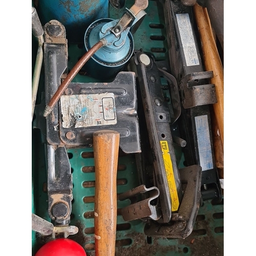 904 - Assorted tools lot, including vintage metal oil can, hammers, car jacks, and license plates.