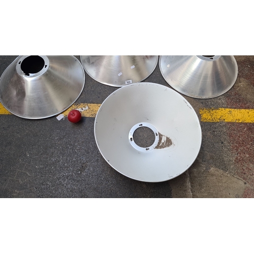 922 - Set of four large aluminum industrial light reflectors.