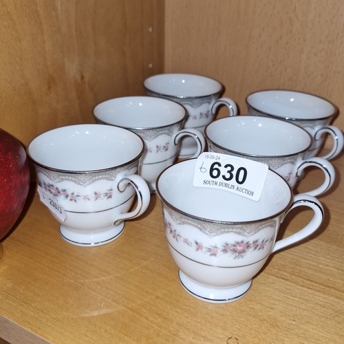 630 - Set of six Noritake bone china teacups with floral motif and gold trim detailing.