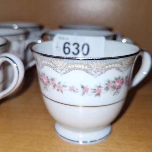 630 - Set of six Noritake bone china teacups with floral motif and gold trim detailing.