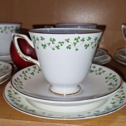 634 - Set of Royal Tara fine bone china teacups, saucers, creamer, and sugar bowl with shamrock pattern, m... 