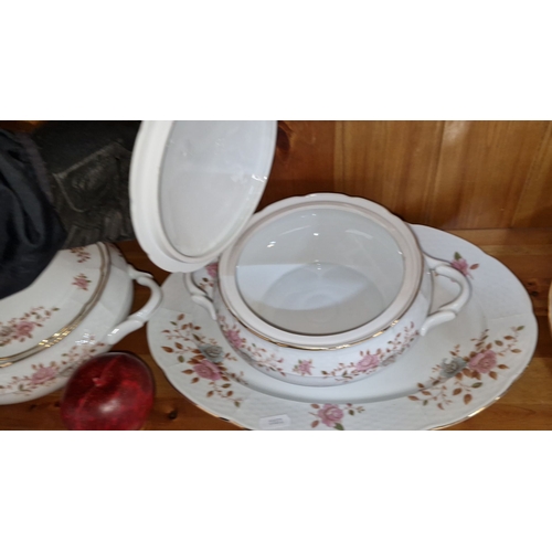 644 - Porcelain dinnerware set features floral motifs and gold trim, includes tureens, platters, and plate... 