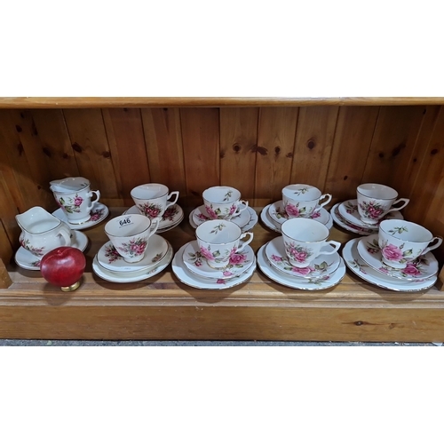 646 - Royal Stuart Roses tea set features rose floral designs with gold trim. Includes eight teacups, sauc... 