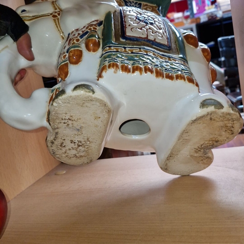 651 - Antique ceramic elephant figurine, intricately hand-painted with vibrant colors and ornate details, ... 