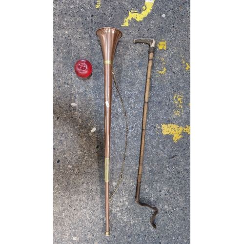 657 - Two hunting items including a 19th century stag horn handled crop along with a brass and copper hunt... 