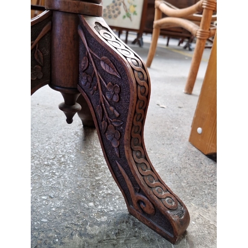 665 - Victorian walnut  stool with intricately carved legs and floral needlepoint upholstery from the late... 