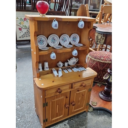 666 - A miniature Vintage wooden dollhouse furniture hutch with miniature tea set, including plates, cups,... 