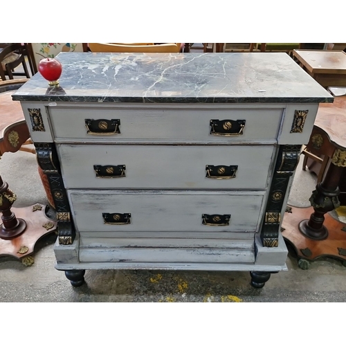 668 - Star Lot : A handsome French Empire-style chest with three drawers, ornate brass handles, and a cold... 