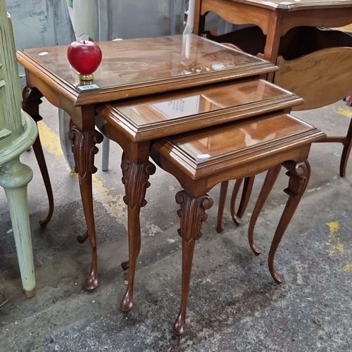 673 - Star Lot : A very handsome Set of three nesting tables, constructed from polished walnut, featuring ... 