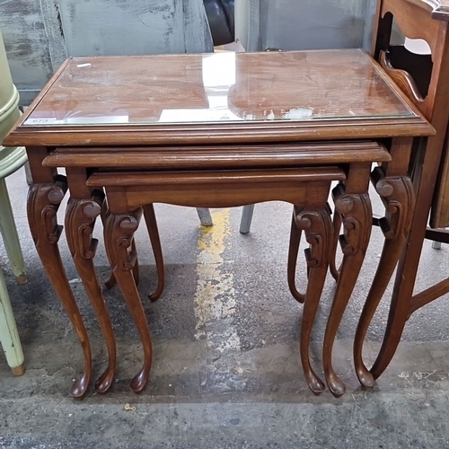 673 - Star Lot : A very handsome Set of three nesting tables, constructed from polished walnut, featuring ... 