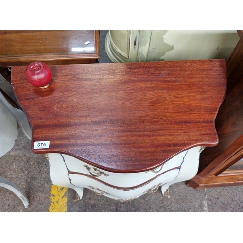 675 - Star Lot : Antique-style bombe chest of drawers with gold-toned handles and trim, featuring a distre... 