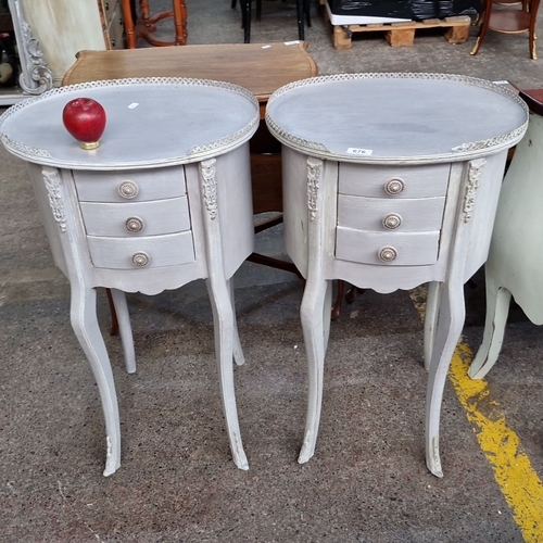 676 - Star Lot : A super pair of painted wooden side tables with three front drawers and intricate carving... 