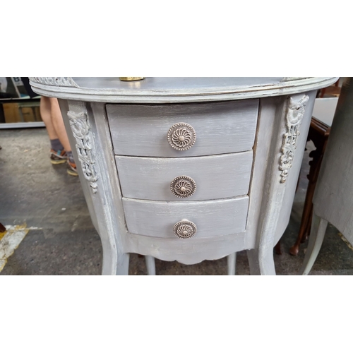 676 - Star Lot : A super pair of painted wooden side tables with three front drawers and intricate carving... 