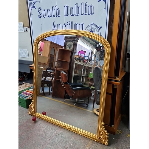 677 - Super Star Lot A super Large gilt over mantle mirror with ornate Rococo-style frame and intricate de... 