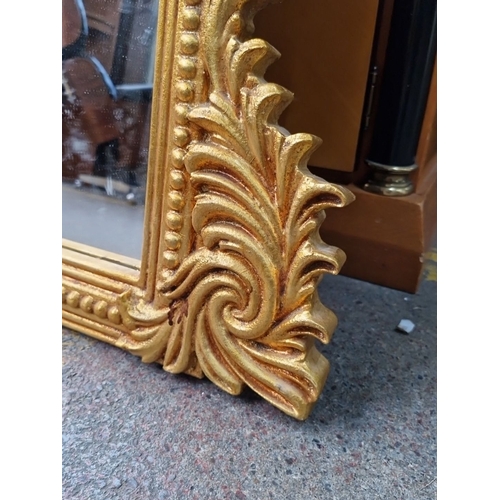 677 - Super Star Lot A super Large gilt over mantle mirror with ornate Rococo-style frame and intricate de... 