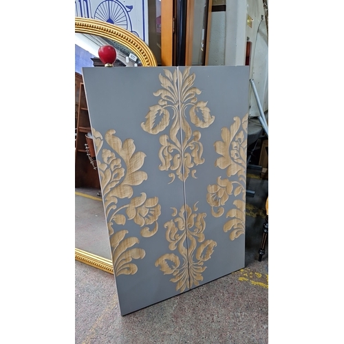 679 - Decorative double panel with floral motif on a grey background. Features intricate carved design. In... 