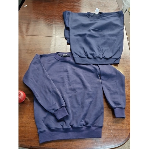 685 - A Large box of brand new School navy blue sweatshirts, each featuring long sleeves and a crew neck d... 