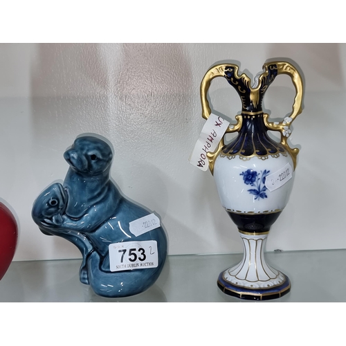 753 - Two ceramic items including a vintage Royal Ducks Amphora bud vase and a Poole pottery otter and his... 