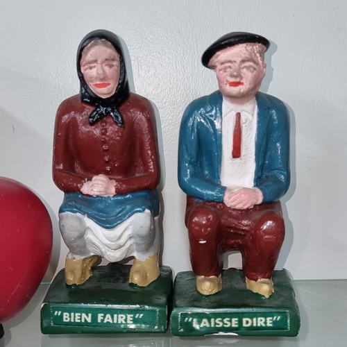 756 - Two chalkware figures reading 