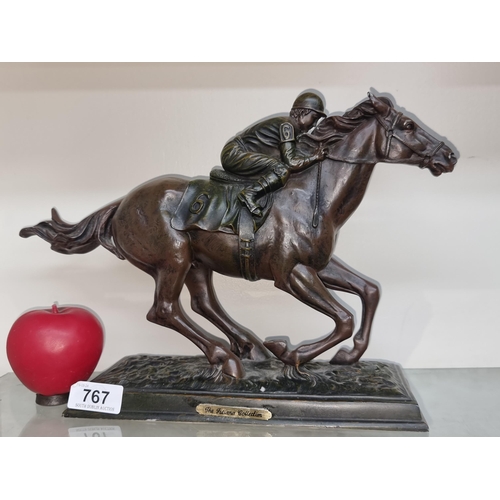 767 - A vintage bronze toned jockey & racehorse figure from the Juliana Collection.