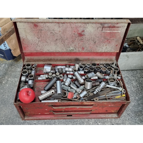 703 - A neat galvanized steal toolbox with a selection of sockets.