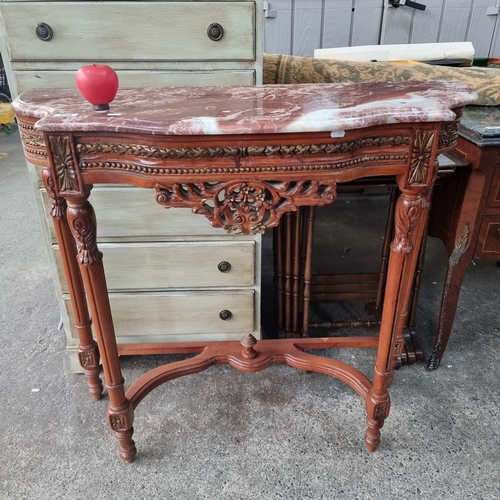 710 - Star Lot : A marble topped French style console table Featuring carved and turned wood tapering legs... 