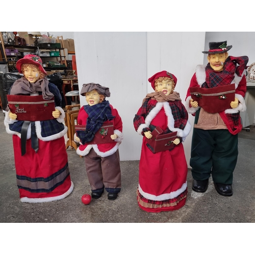 734 - A charming very large family of carol singers. Figures measure over 1m tall. Great Decor for Crimbo.