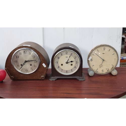 737 - Three vintage mantel clocks including a 1930's oak cased example, a Smiths of Enfield mahogany cased... 