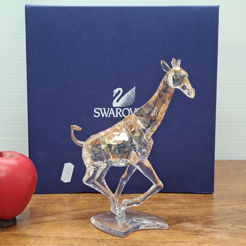 785 - Star lot : A stunning Swarovski Crystal large galloping Giraffe 935896. In original presentation box... 