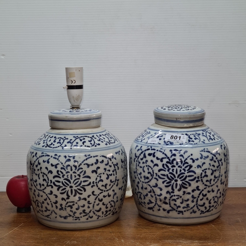 801 - A pair of attractive blue and white ginger jars one of which has been adapted into a table lamp.