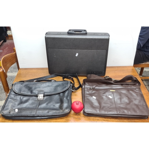 804 - Three laptop / briefcases including a combi lock hard case Samsonite example, a brown leather Ashwoo... 