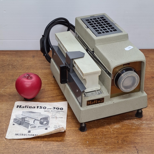 806 - A vintage Halina 150 semi automatic slide projector. In original box with instructions for use.