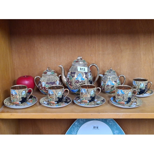 812 - A very decorative Oriental hand painted 13 piece tea set with teapot, cups, saucers, milk jug and li... 