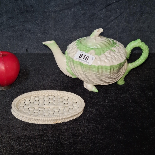 816 - Star lot : Two antique Belleek pieces including a black stamp teapot and tea pot stand. Both in grea... 