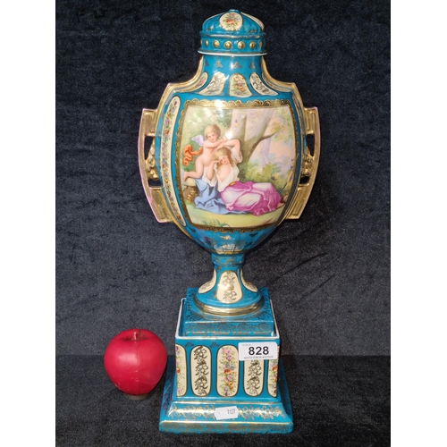 828 - A beautiful incredibly detailed hand painted porcelain vase featuring a light blue colour. Depicting... 