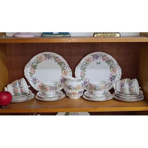 830 - A 22 piece Paragon China tea set comprising of cups, side plates, saucers, milk jug and sugar bowl. ... 