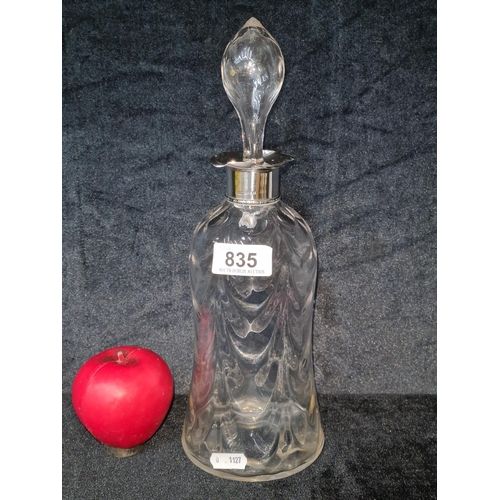 835 - A hallmarked silver collared decanter with original stopper. Marked 1906 Birmingham.