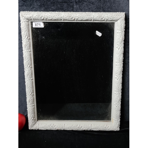 871 - A pretty wall hanging mirror. Housed in decorative painted wooden frame. 
MM: 38 x 48 cm including f... 