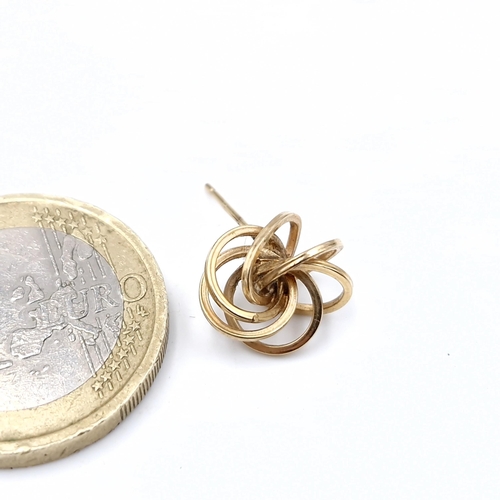 502 - A single  nine carat gold earring marked to post (no back) Weight 0.4 grams.