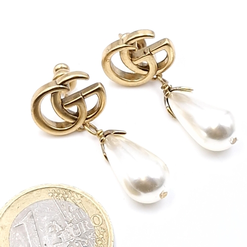 507 - Star Lot : A pair of brand new original designer Gucci pearl drop stud earrings. Weight - 6.43 grams... 